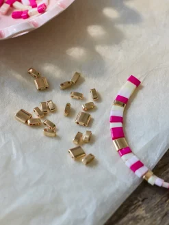 Metalliske fliseperler